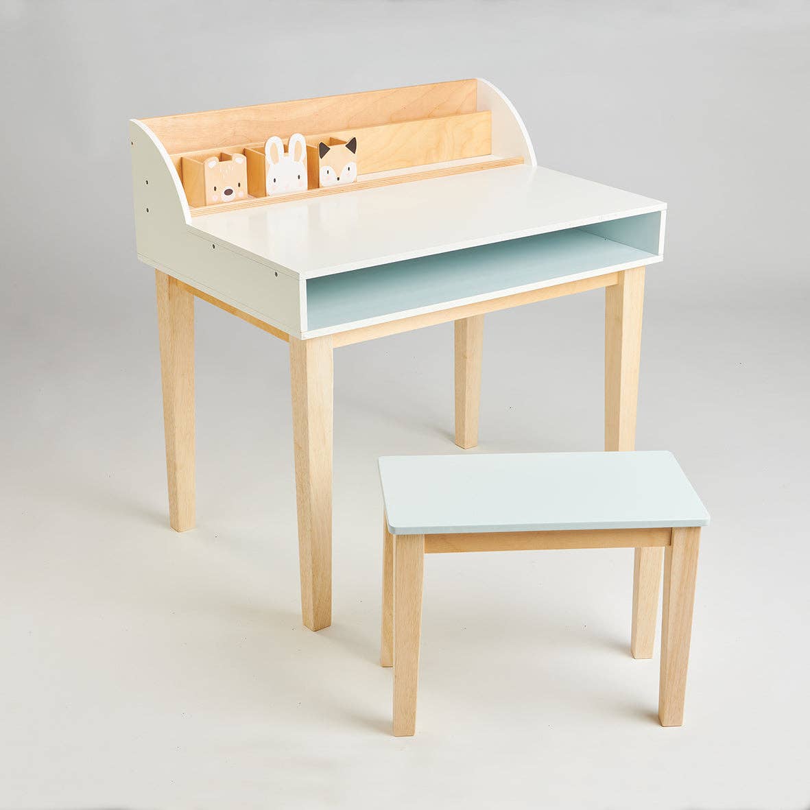 Childs Wooden Drawing Desk and Stool with pastel blue tabletop, natural wood legs, and cute forest animal pen holders. Ideal for toddlers aged 3+.