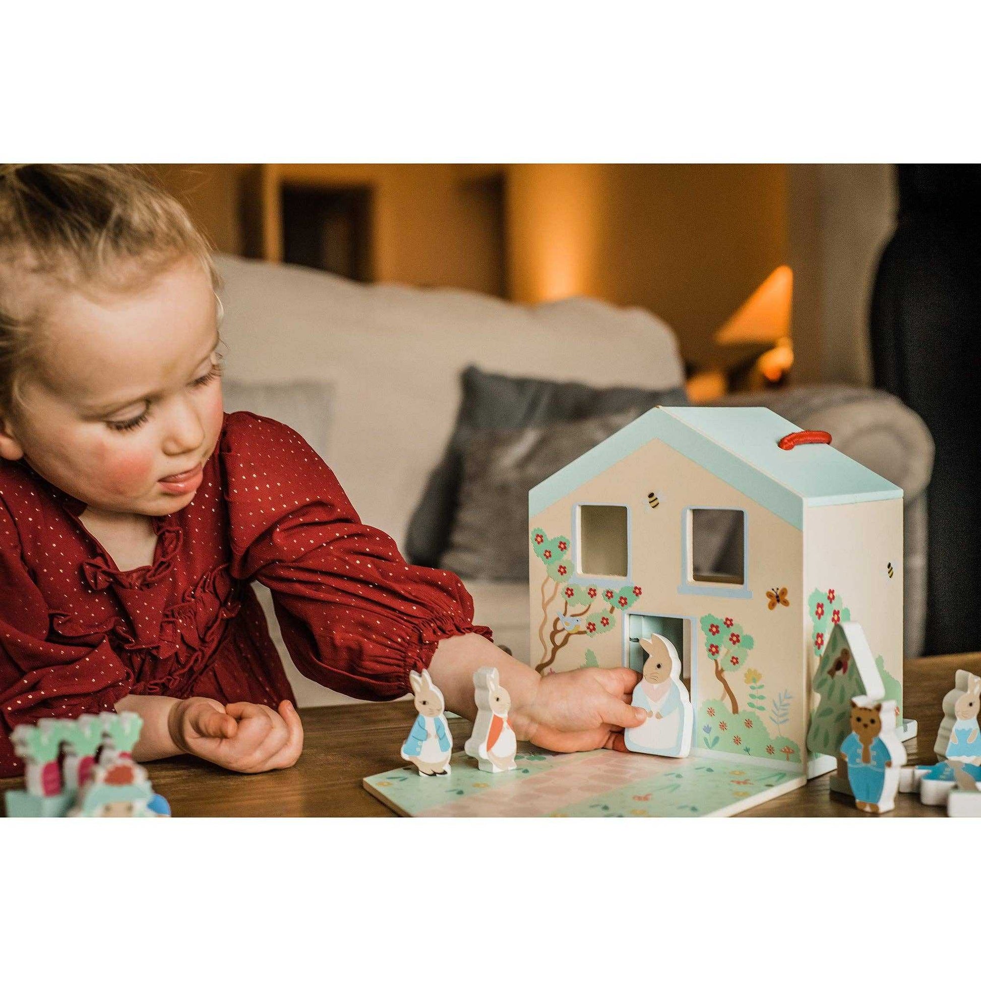 Child playing with Orange Tree Toys Wooden Peter Rabbit™ Character Play Set, showcasing interactive storytelling and creative play for toddlers.