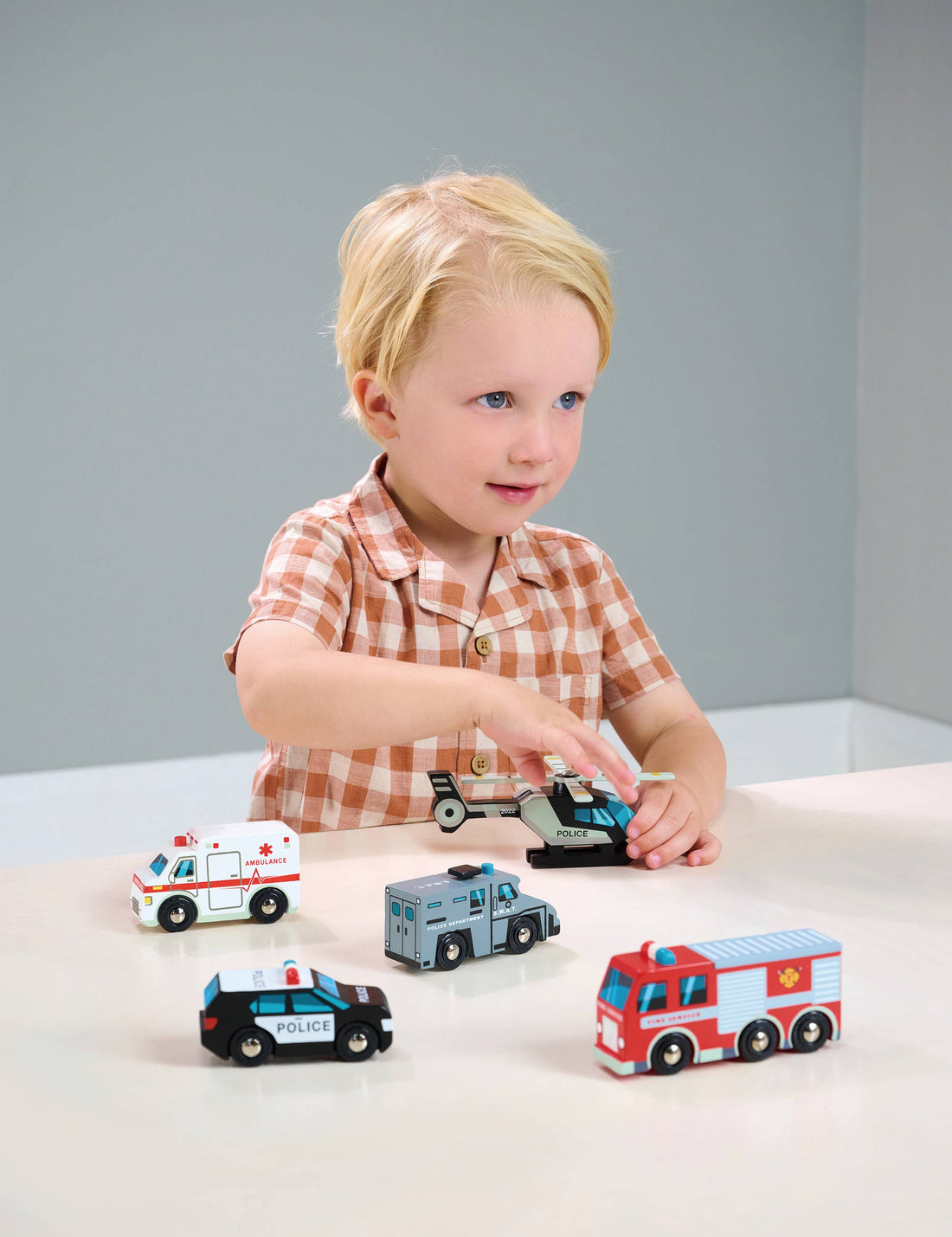 Wooden Toy Emergency Vehicles Play Set featuring a police helicopter, ambulance, fire truck, SWAT van, and police car. Ideal for kids aged 3+.