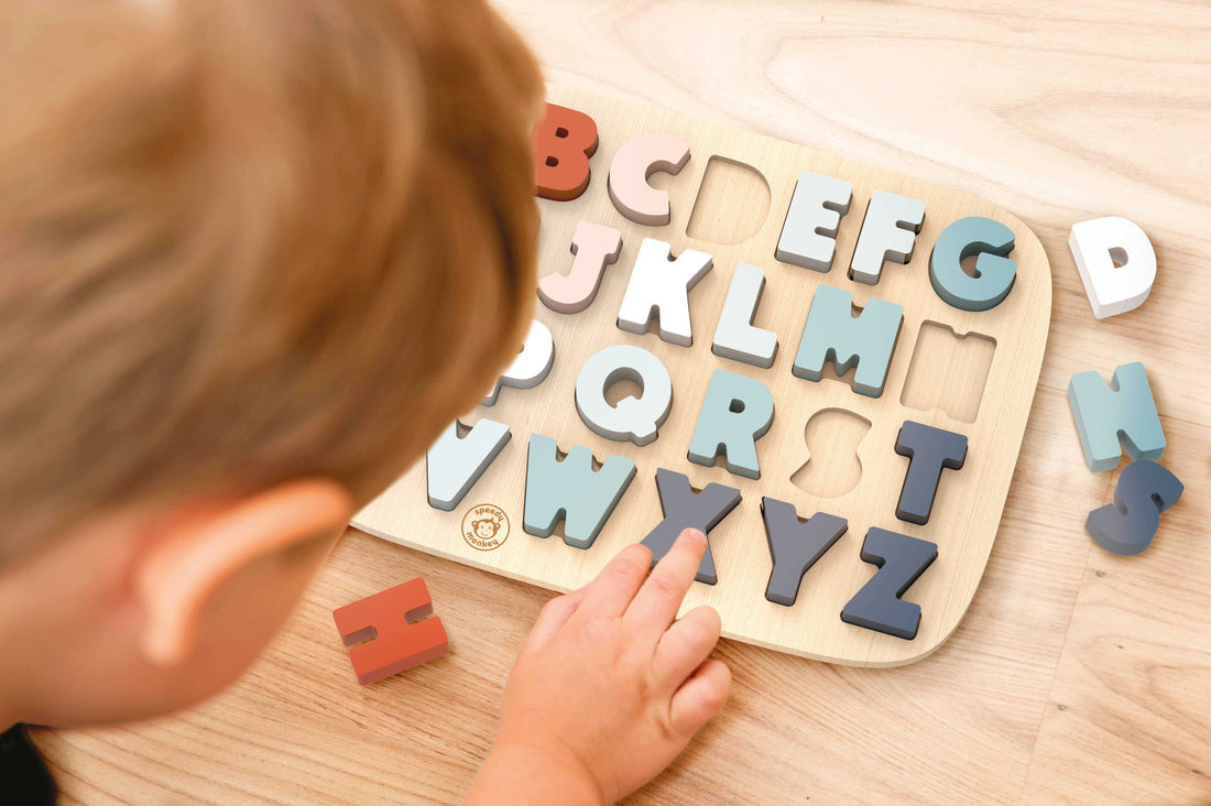 Speedy Monkey wooden alphabet puzzle with colorful 3D letters on a natural wood board. Fun learning toy for toddlers aged 12+ months.