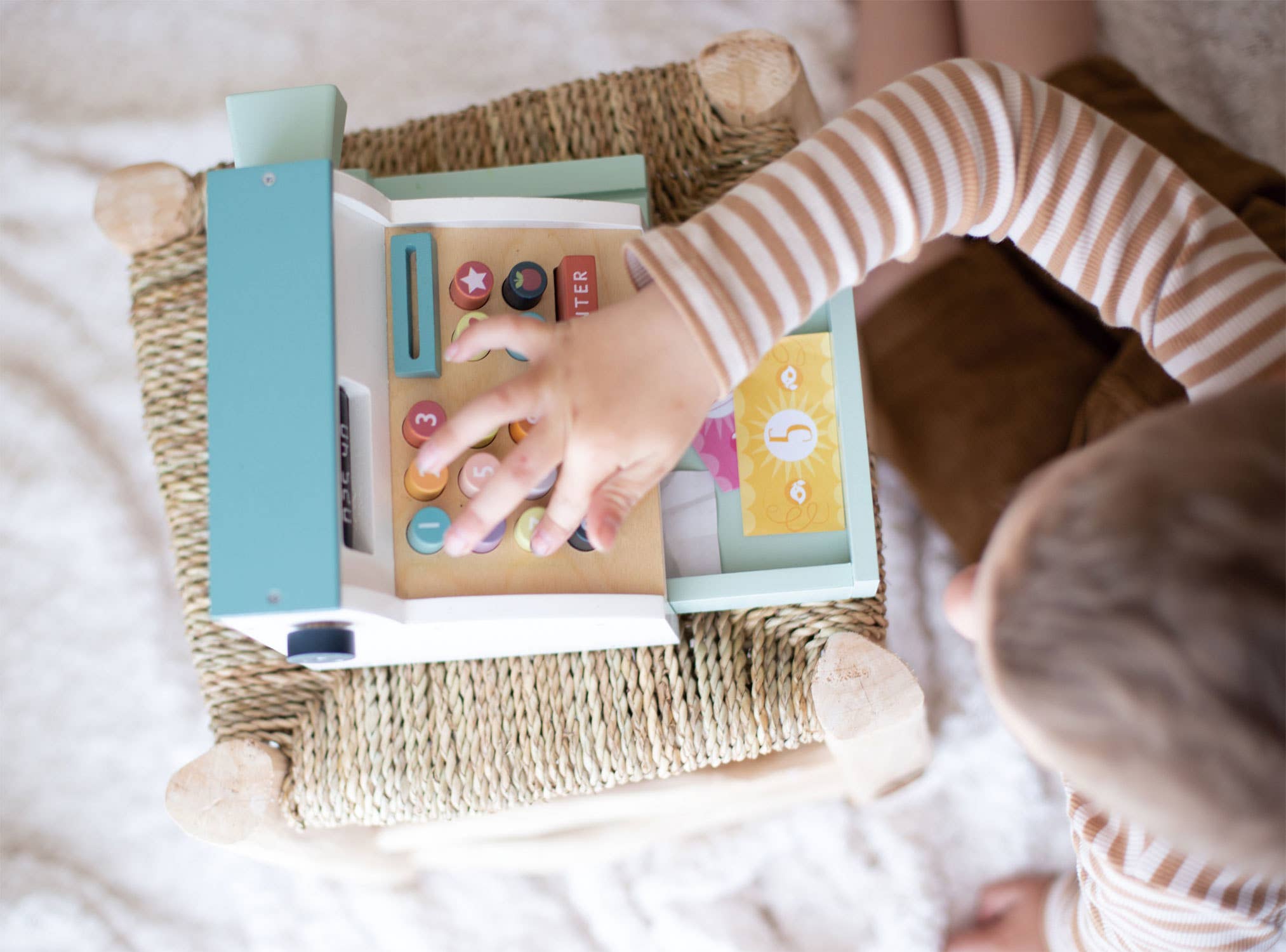 Top view of child pressing buttons on Wooden Role Play Shop Till & Scanner - General Stores Till, encouraging number recognition.