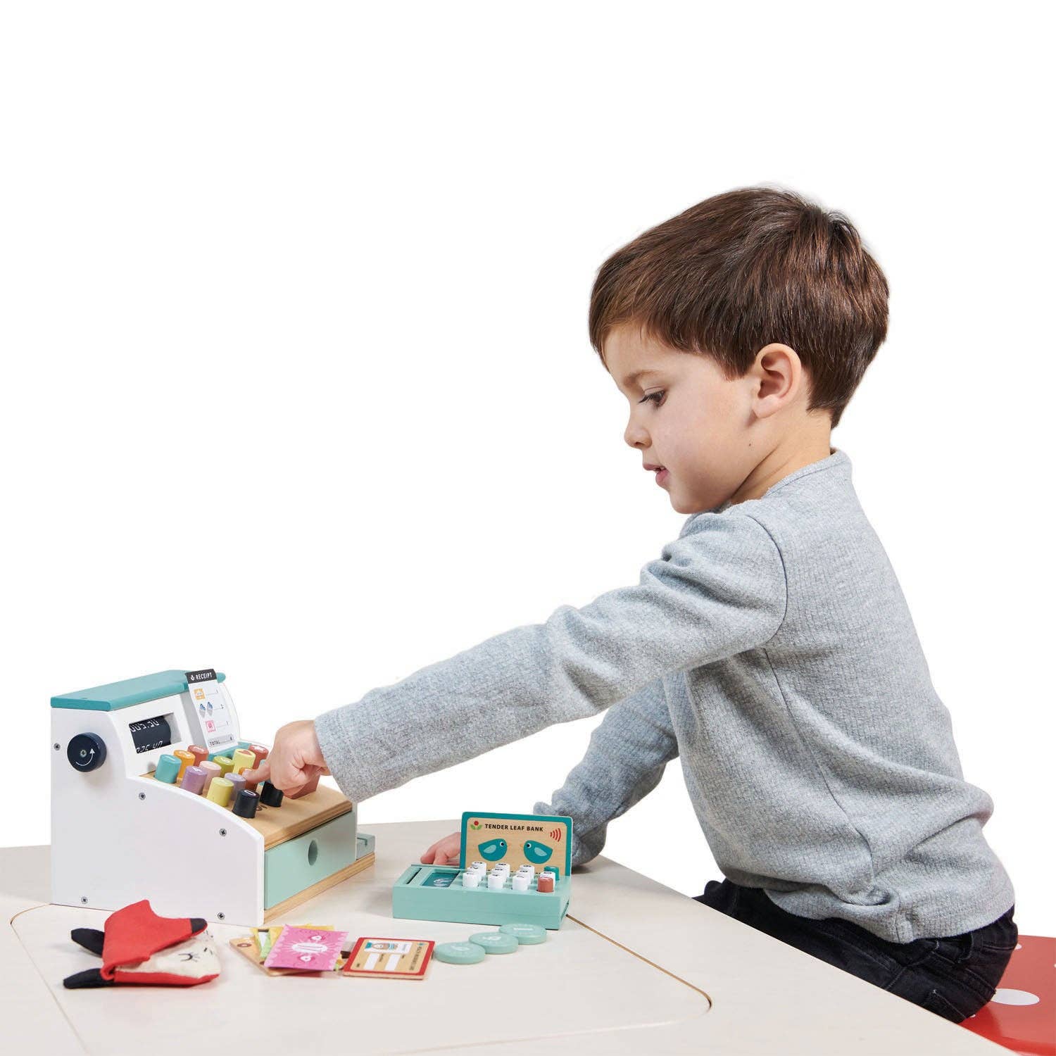 Boy interacting with Wooden Role Play Shop Till & Scanner - General Stores Till, enhancing counting and imaginative play skills.