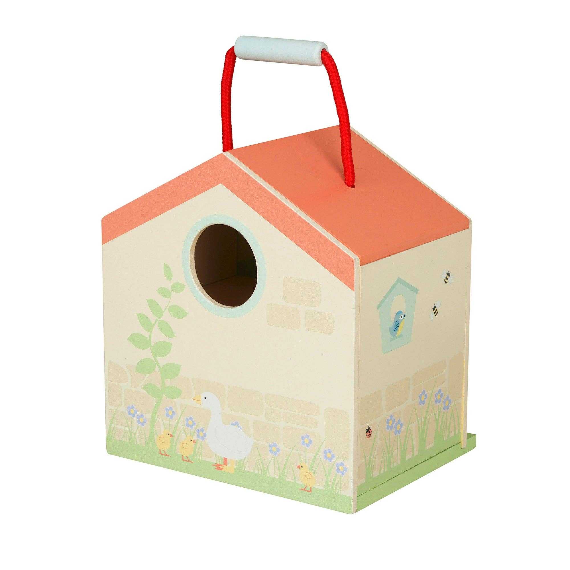 Back view of the Wooden Farmyard Animals Toy Play Set barn showing duck and floral illustrations with red rope handle for portability.