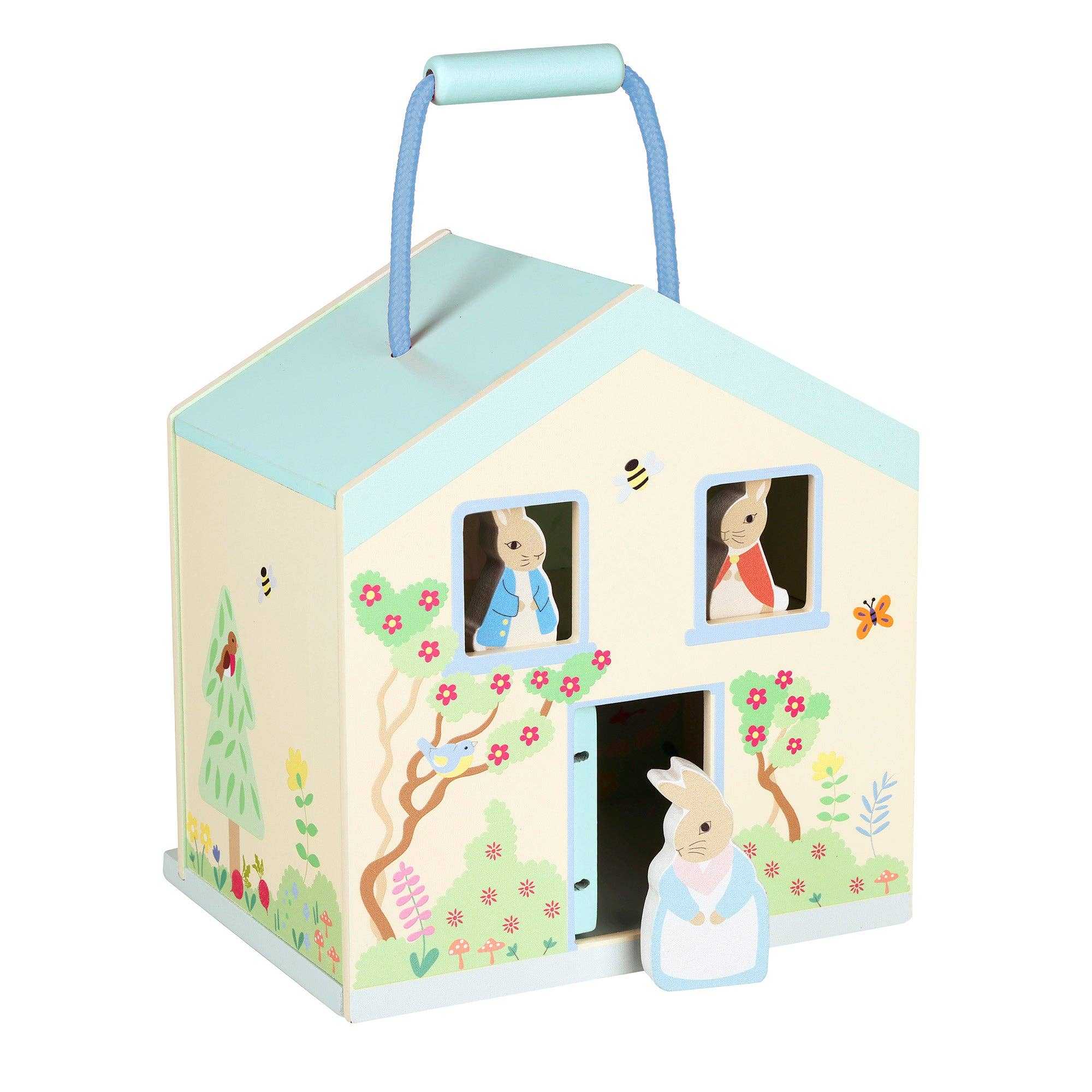 Front view of Orange Tree Toys Wooden Peter Rabbit™ Playhouse with characters in windows and doorway, ideal for portable and eco-friendly play.