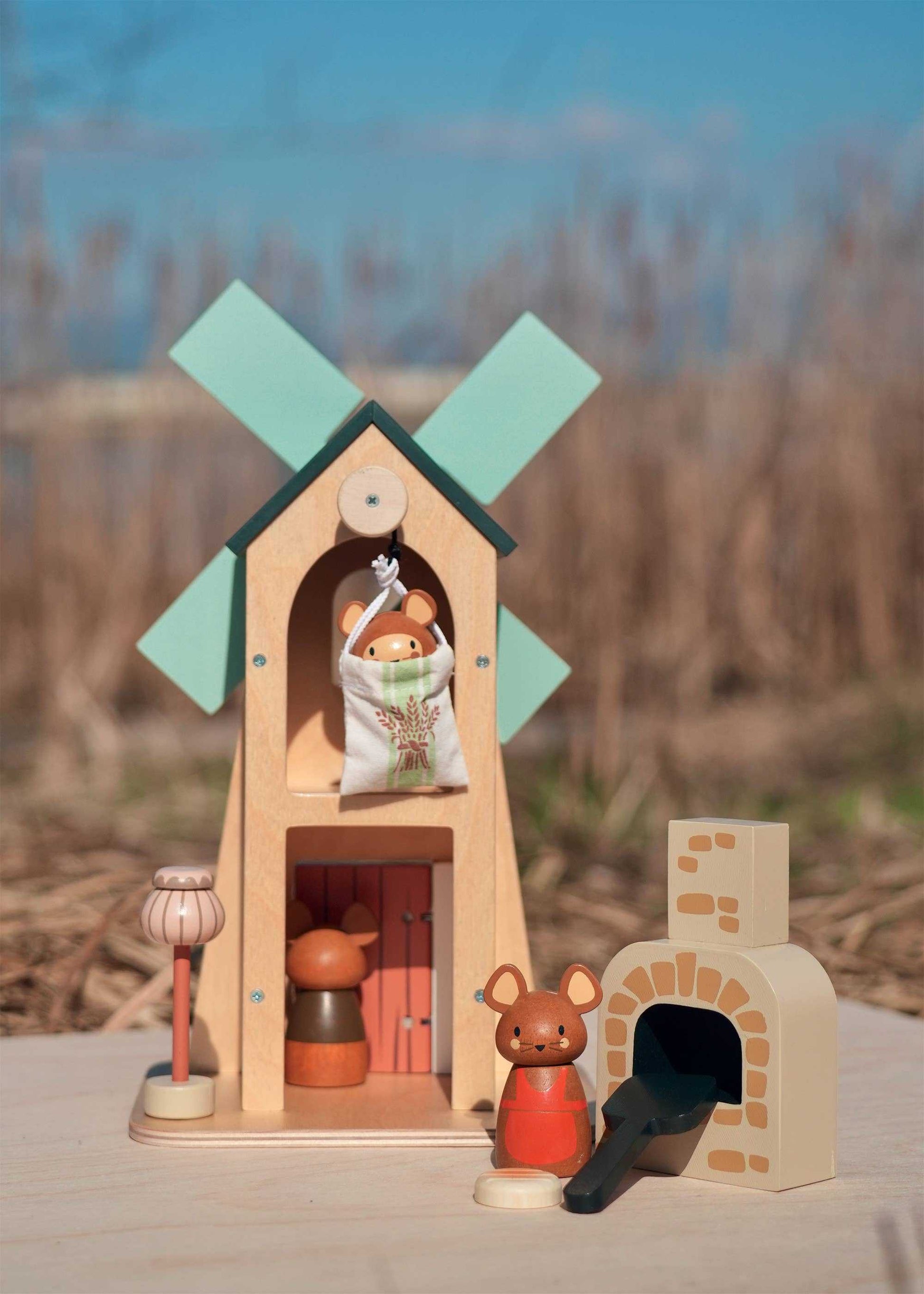 Penny Windmill Character Play Set Wooden Toy displayed outdoors with mouse characters, oven, and windmill, showcasing imaginative woodland play.