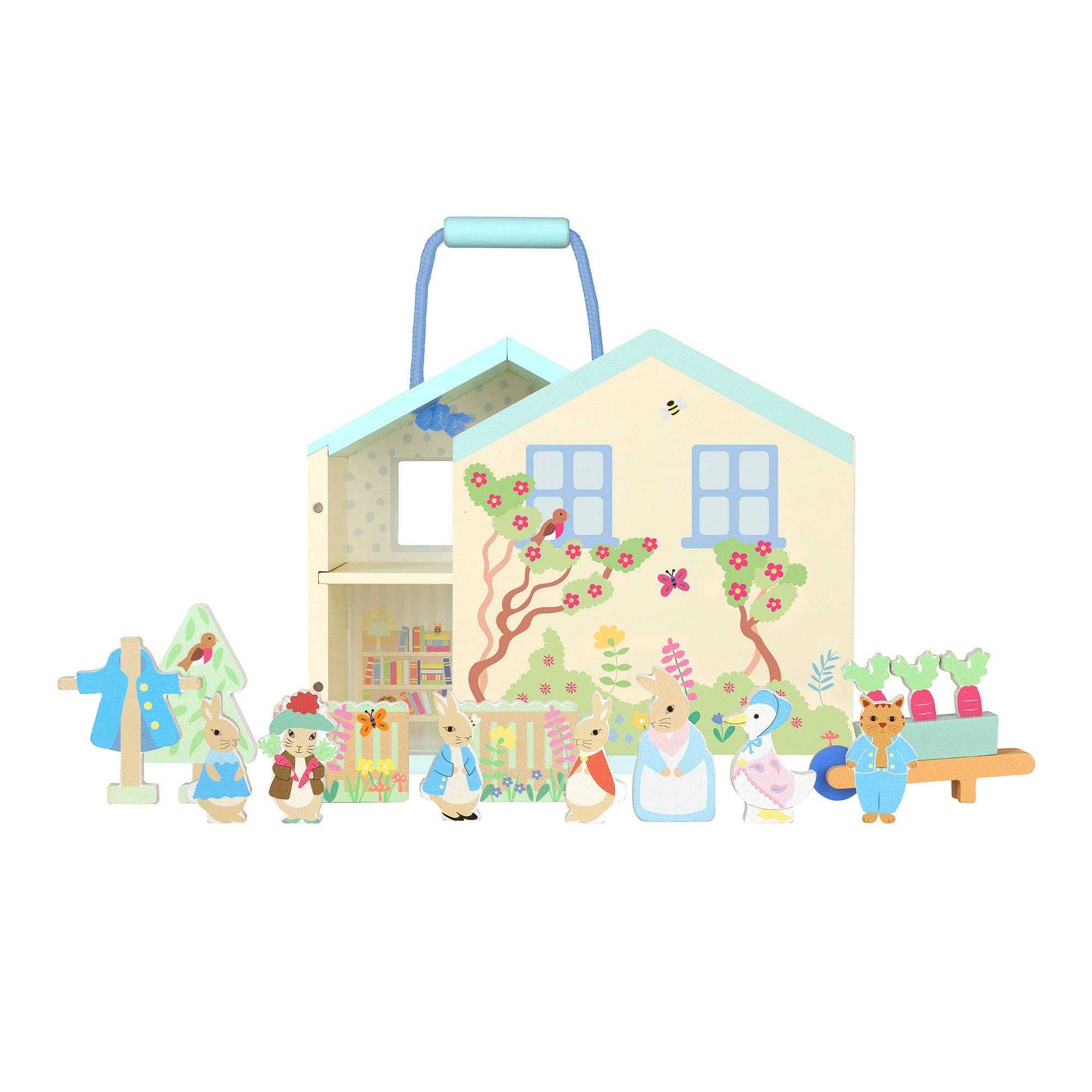 Complete Orange Tree Toys Wooden Peter Rabbit™ Character Play Set with 9 wooden figures, garden cart, and illustrated house backdrop for ages 3+.