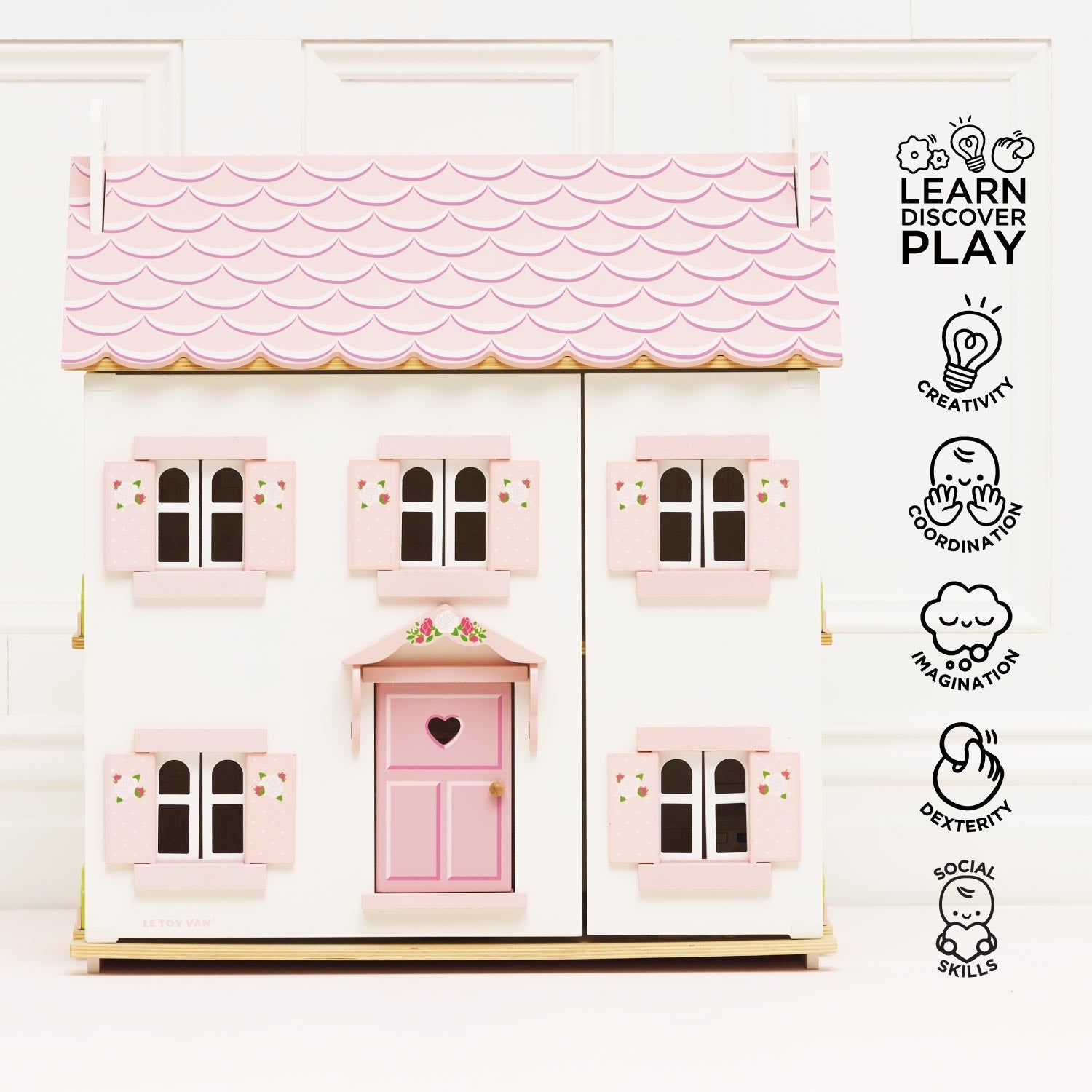 Front view of Le Toy Van Sophie's Wooden Dolls House with icons highlighting creativity, imagination, and social skill development.