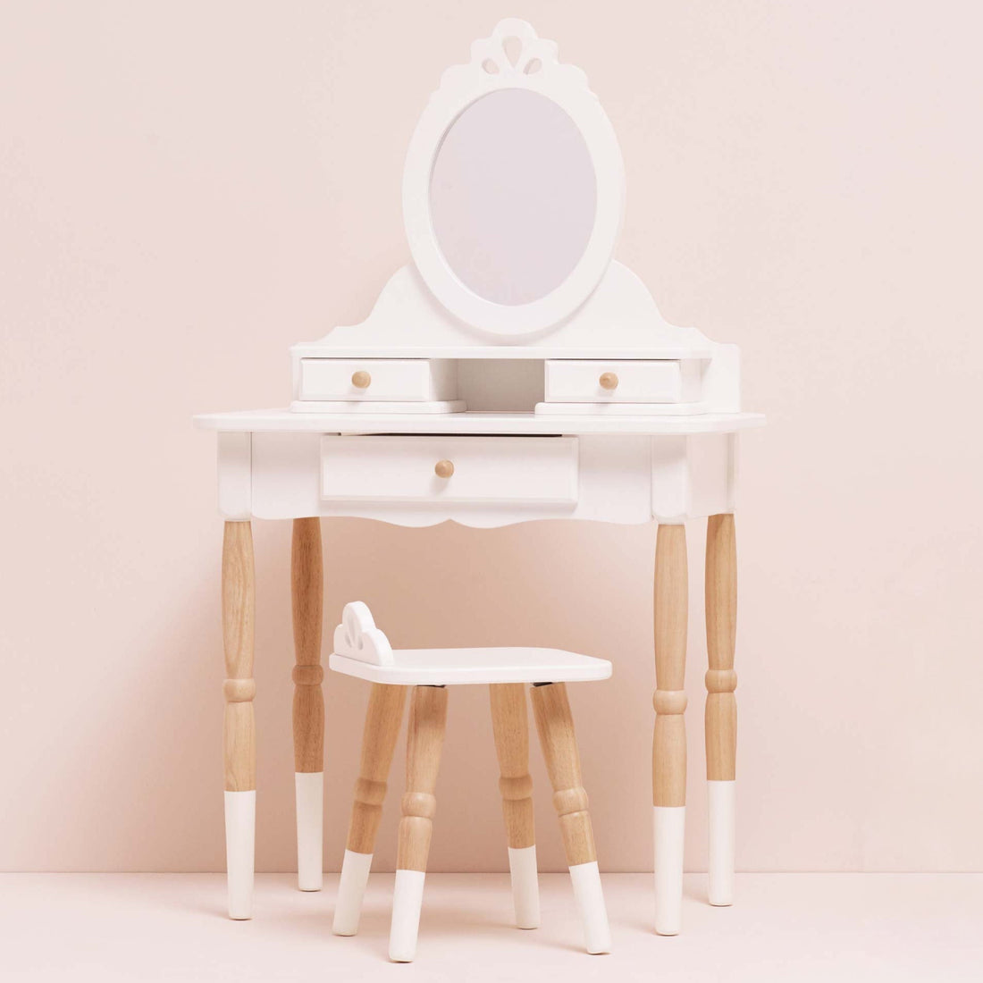 Le Toy Van child's vanity set with mirror, drawers, and stool in white and natural wood finish, ideal for toddler imaginative play.