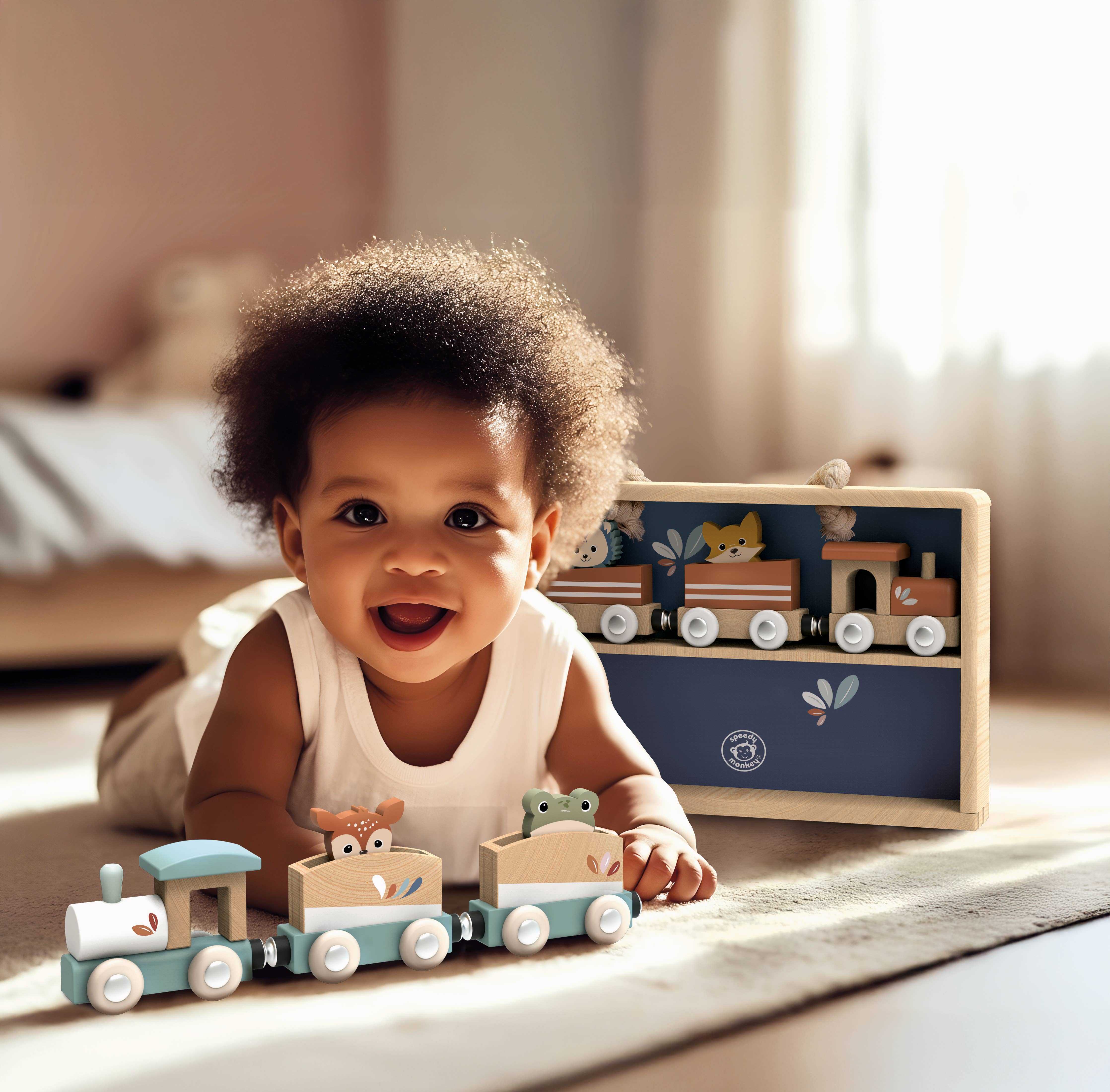 Smiling toddler plays with Speedy Monkey Wooden Trains Toy Set featuring animal-themed train cars and a wooden display case, ideal for toddlers 18+ months.