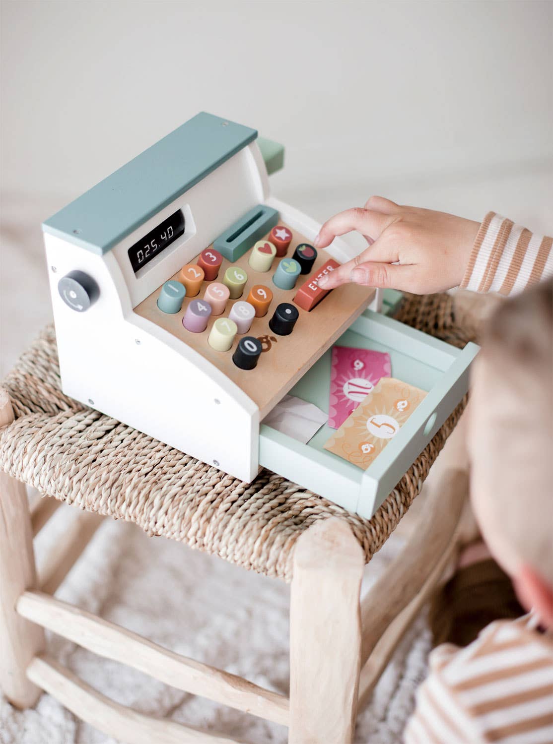 Child opening cash drawer of Wooden Role Play Shop Till & Scanner - General Stores Till, exploring play money and role play.