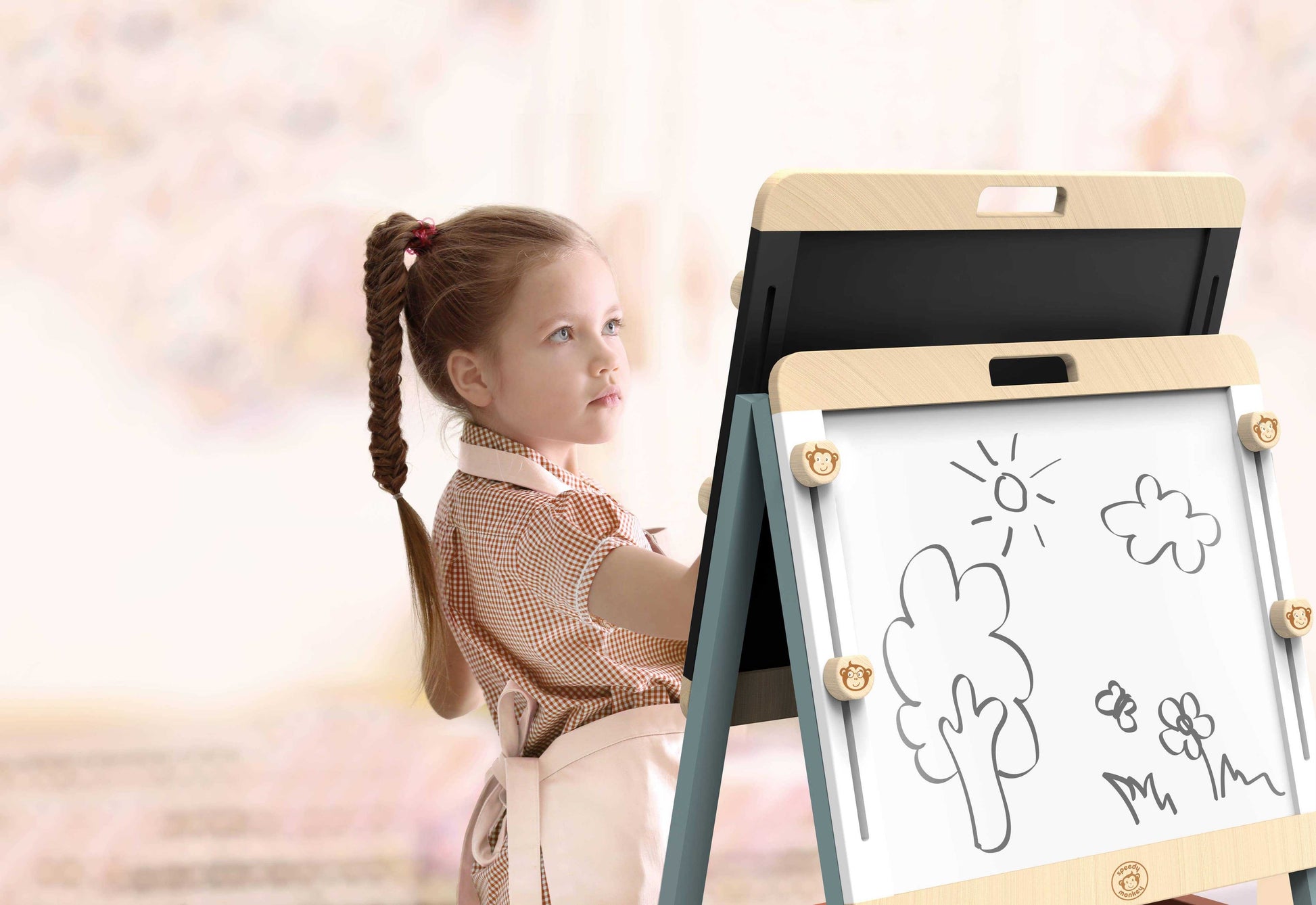 Young girl drawing on the Speedy Monkey Childs Wooden Adjustable Easel & Chalk Board whiteboard side. Encourages creative and educational play.