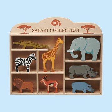 Wooden safari animal toy set displayed in a wooden shelf labeledSafari Collection," featuring animals like a crocodile, giraffe, elephant, zebra, rhino, and antelope on a light blue background.